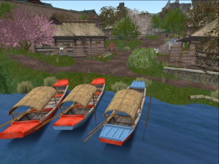 Boats beached in village cove with houses